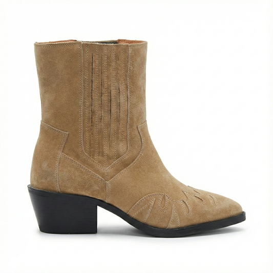 Tan suede western ankle boot with pointed toe, decorative toe stitching, and a black stacked block heel