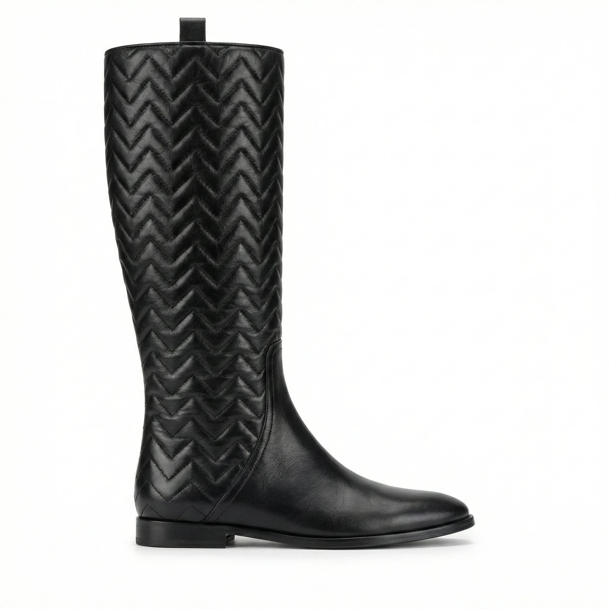 Black knee-high leather boot with chevron quilted shaft, smooth rounded toe, low heel, and back pull tab.