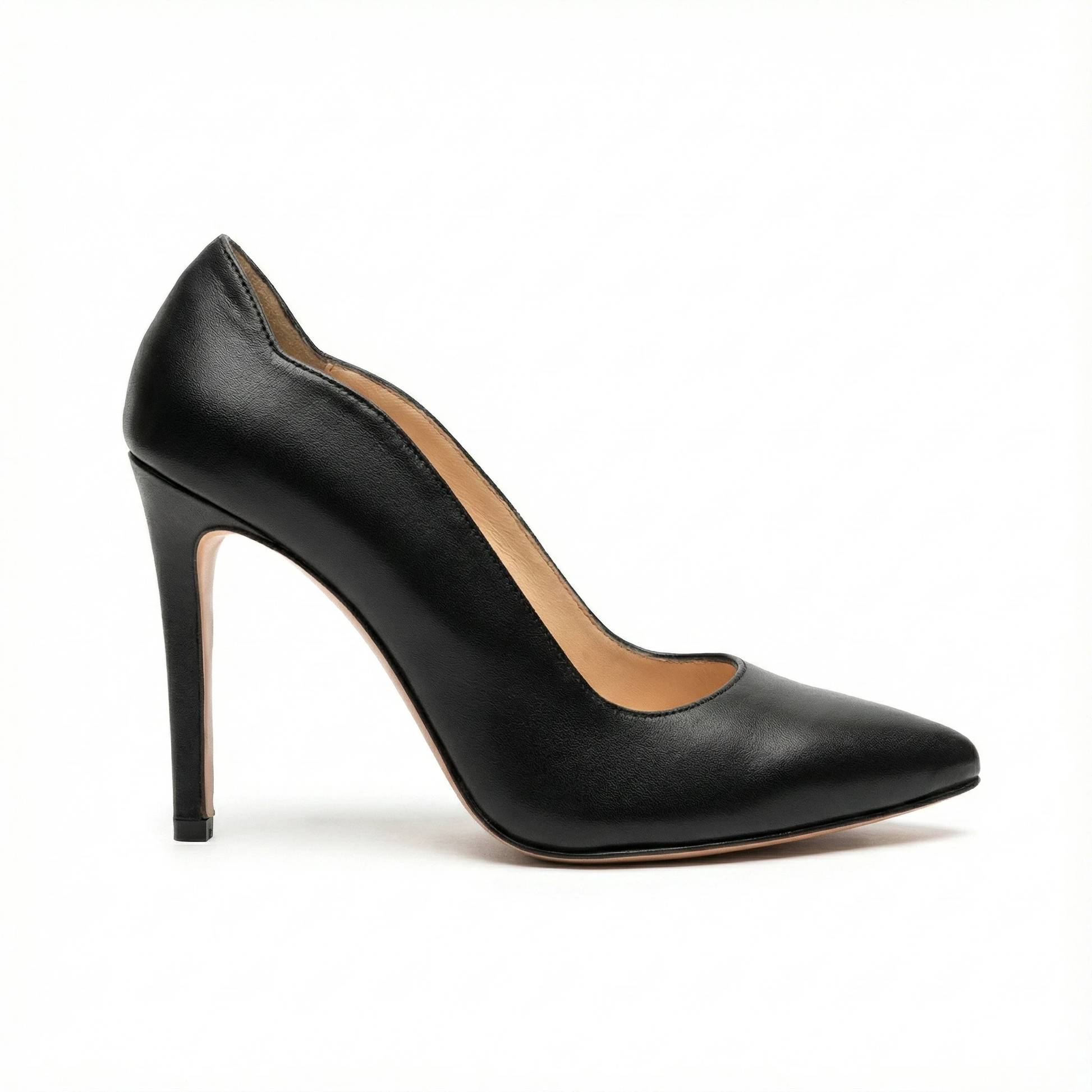 Black leather pointed-toe stiletto pump with a thin high heel and tan interior.