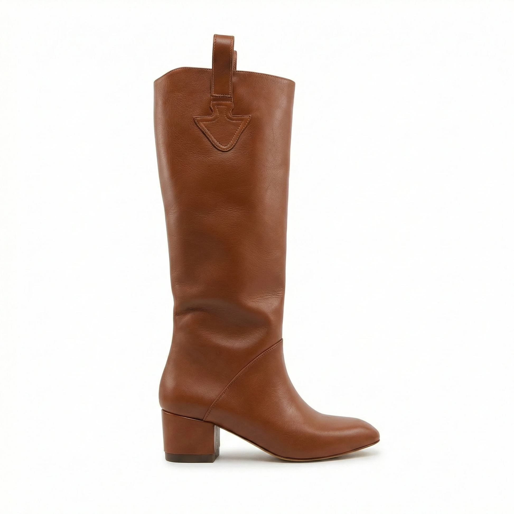 Cognac leather knee-high boot with rounded toe and mid-height block heel, top strap with shield-shaped stitch detail.