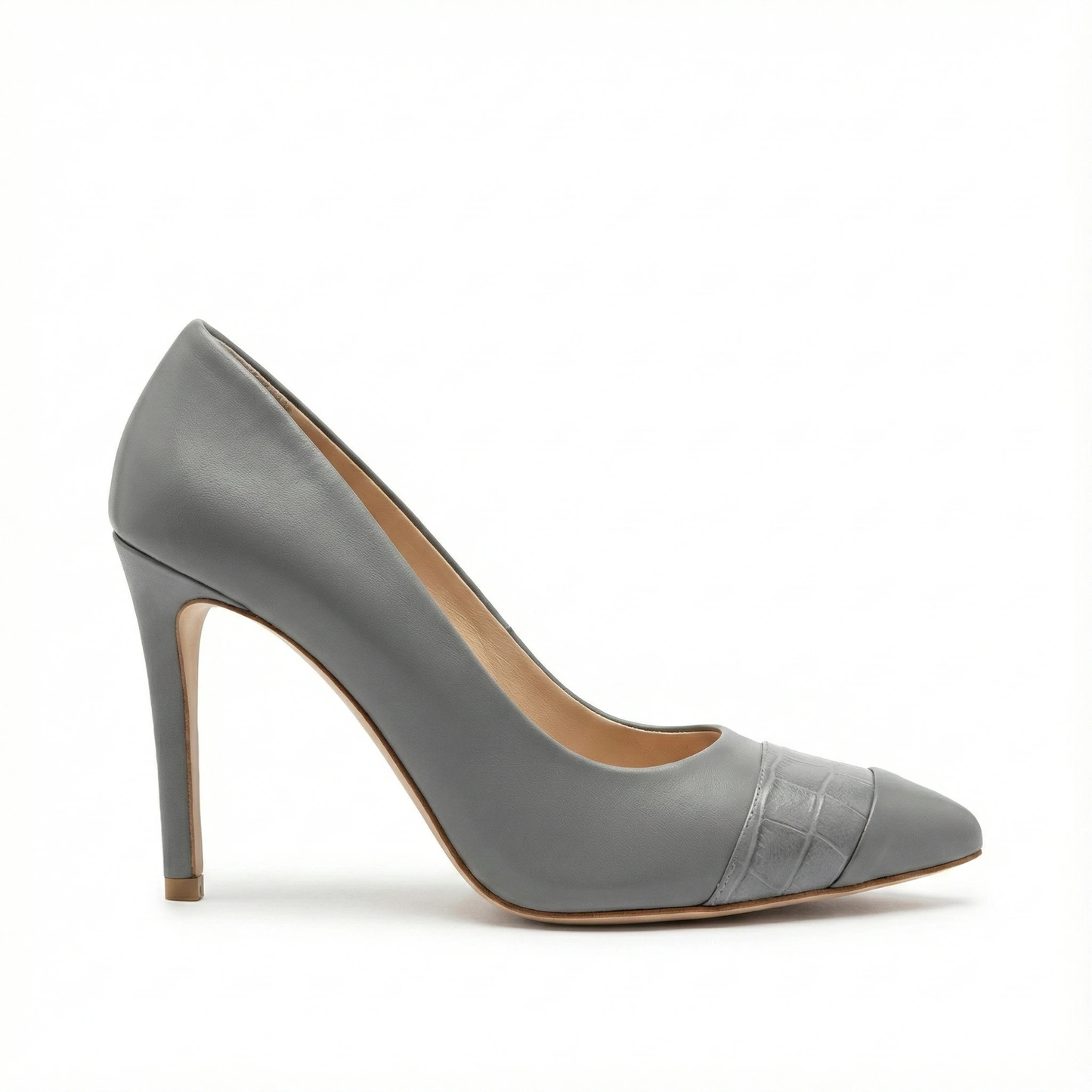 Grey leather pointed-toe pump with embossed cap toe detail, slender stiletto heel, tan sole and beige lining.