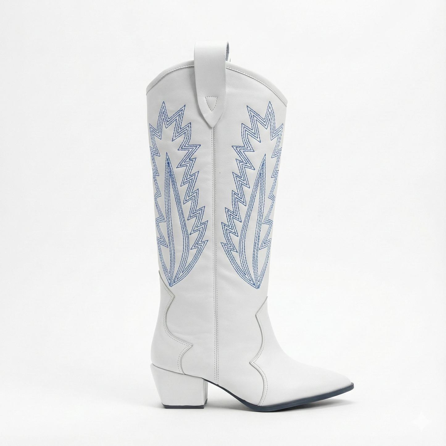 White leather Western boot with blue flame embroidery on the shaft, pull tab at top, pointed toe and stacked heel.