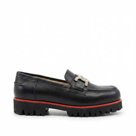 Black leather loafer with a chunky lug sole, silver bit hardware, and a red midsole trim.