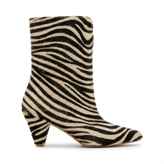 Women's zebra-print mid-calf boot with fuzzy fur texture, almond toe, curved block heel.